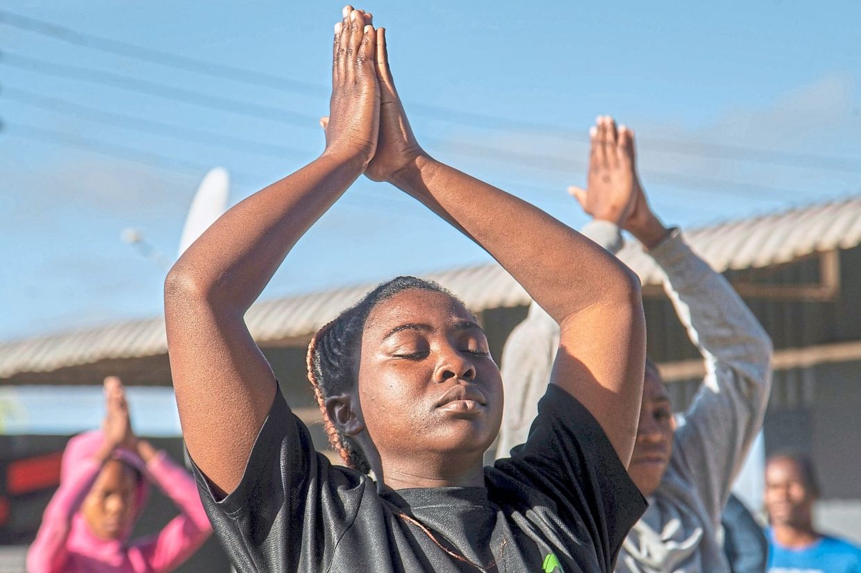 Yoga in a tavern is the latest mental health outreach in Zimbabwe