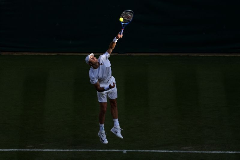 Tennis-Britain's Draper races past injured Baez in Wimbledon opener