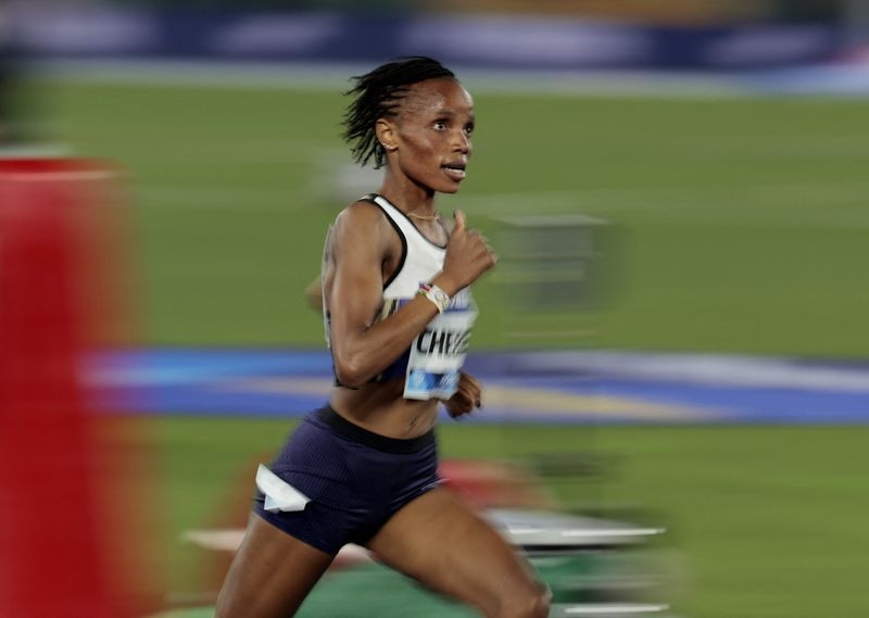 Athletics-Kenyan Chebet breaks women's 5,000 metres world record