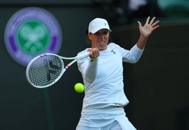 Tennis-Swiatek ends Tauson's run to fly into Wimbledon quarter-finals