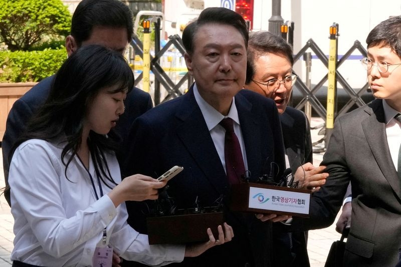 South Korea's former President Yoon to attend hearing on detention warrant