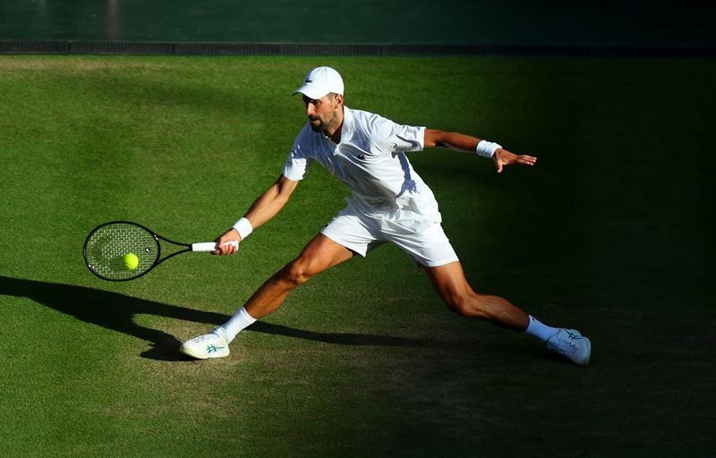 Tennis-Milestone man Djokovic downs Cobolli, reaches 14th Wimbledon semi-final
