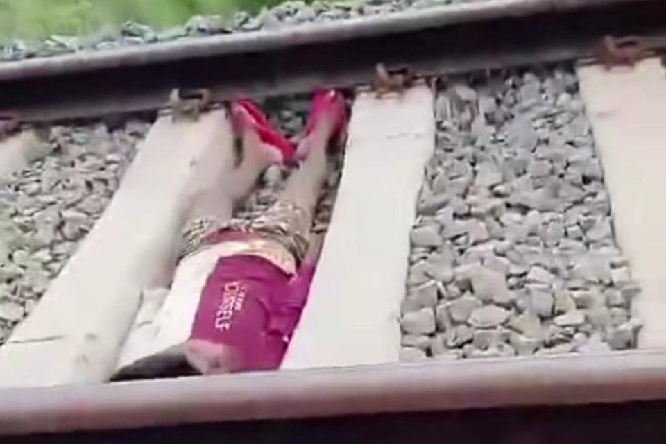 Boy in India detained after lying on tracks as train speeds by for viral social media clip
