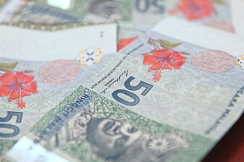 Ringgit eases amid cautious sentiment