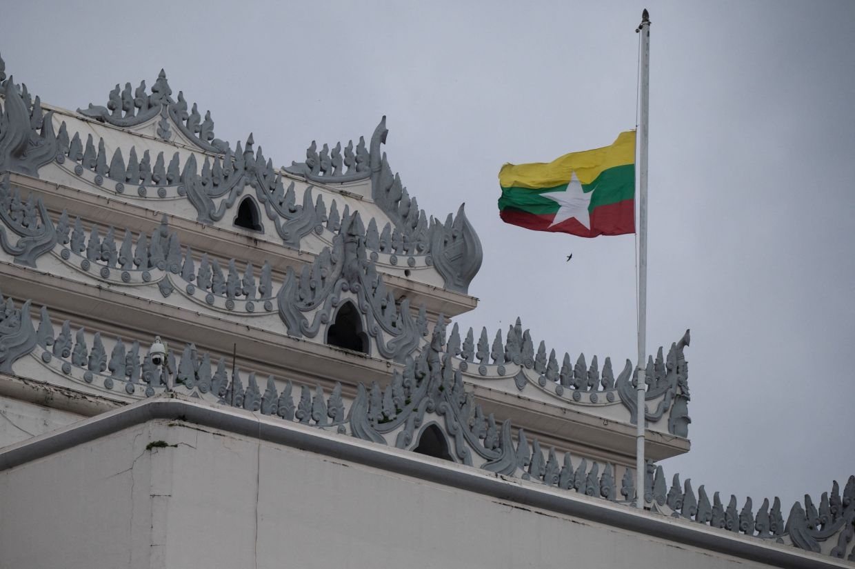 Myanmar's military leader puts in a rare appearance at event honoring Aung San Suu Kyi's father
