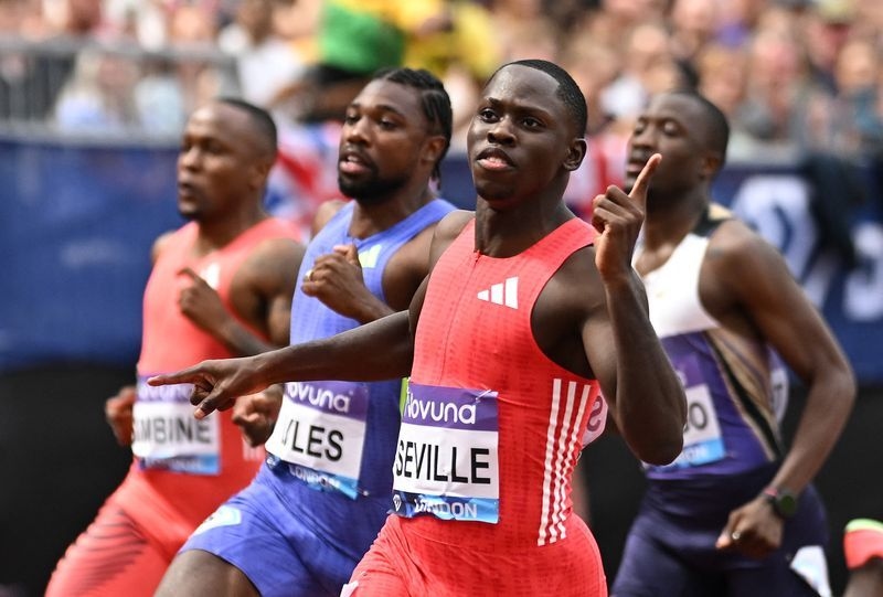 Athletics-Fast-starting Seville beats Lyles in London 100m