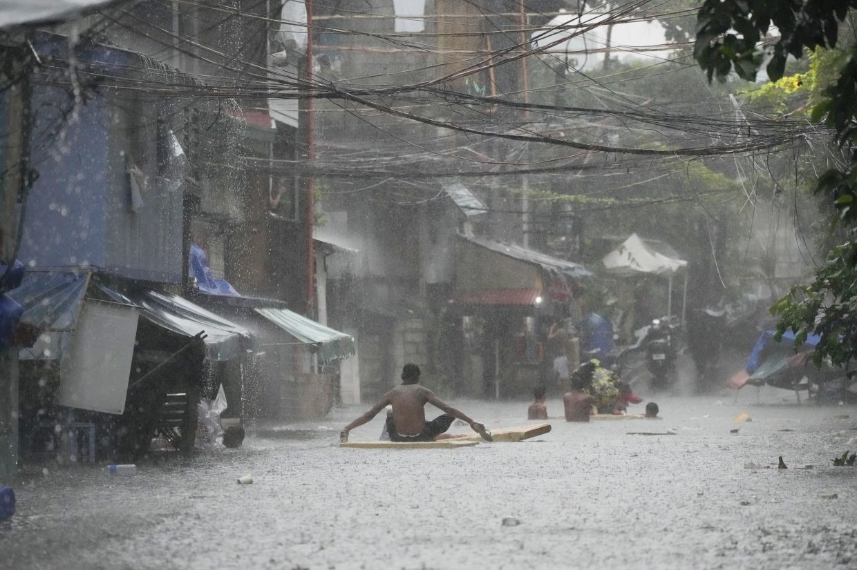 Typhoon Wipha rips through Laos, Vietnam, and the Philippines, damaging homes and infrastructure