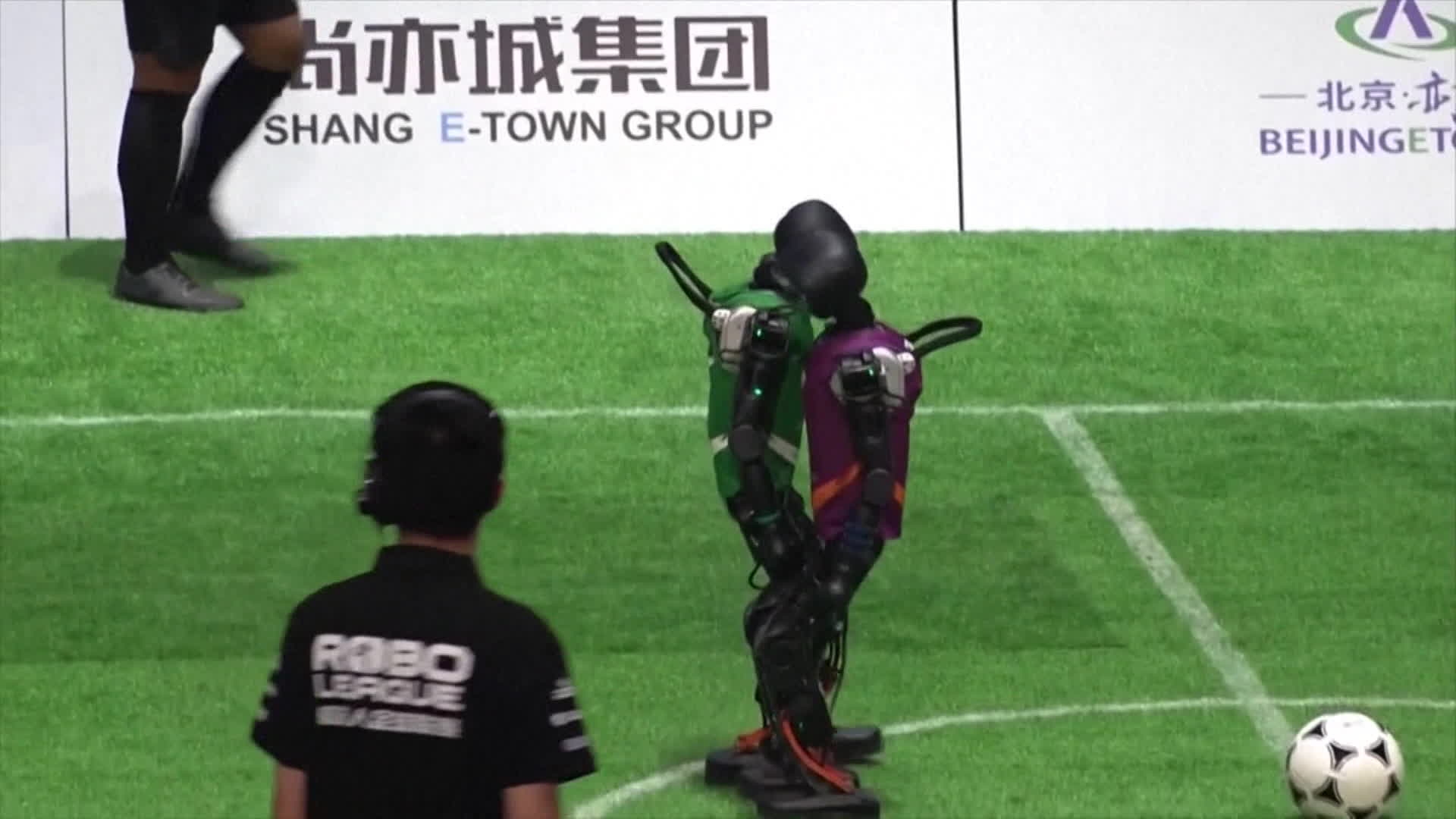 Humanoid Robots Play Soccer Badly in Beijing