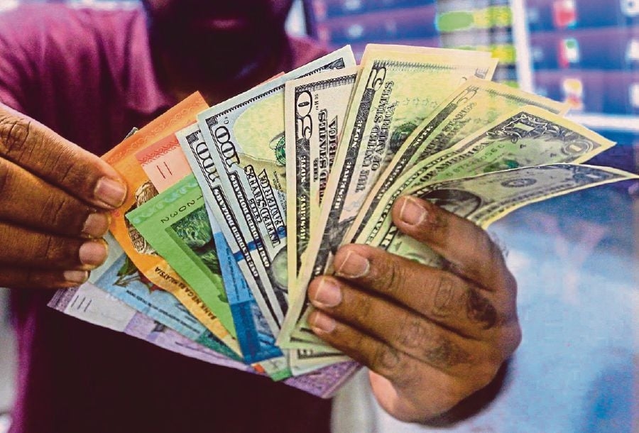 Ringgit eases against US dollar amid cautious market sentiment
