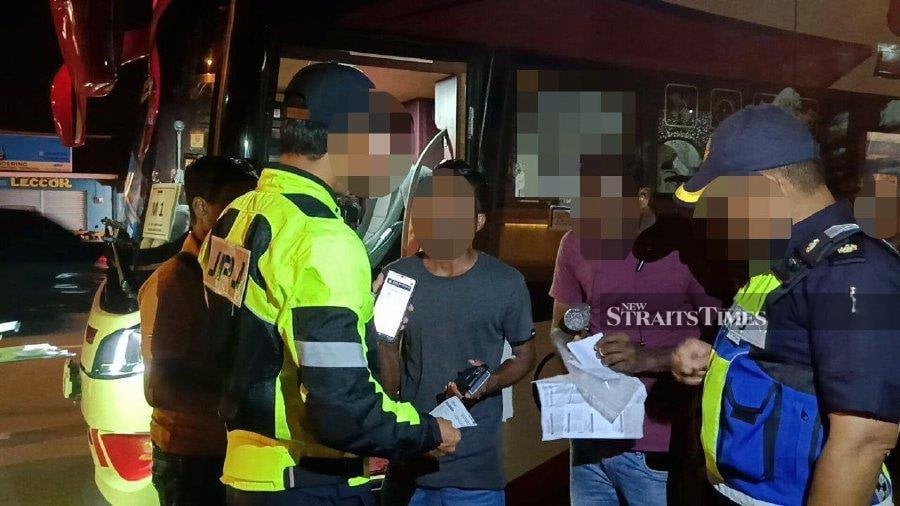 Express bus driver, three passengers issued summonses for not wearing seat belt