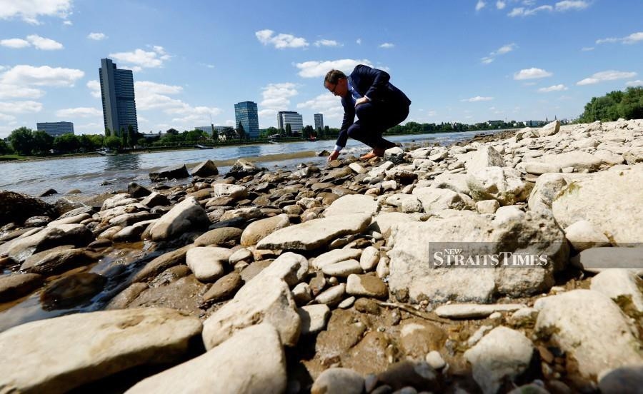 Low water levels hamper shipping in Germany's Rhine River as heat wave continues