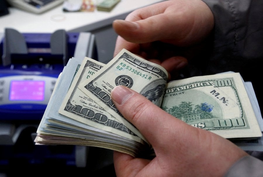 Dollar feeble as Trump's tax bill and tariffs weigh