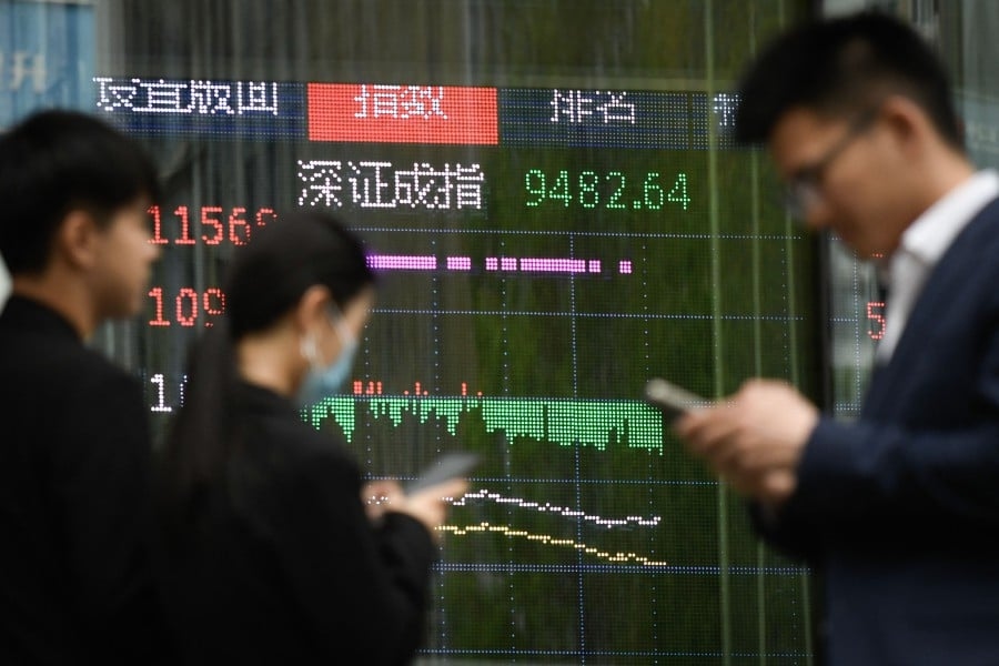 Asian stocks wobble, dollar edges down with tariff deadline in focus