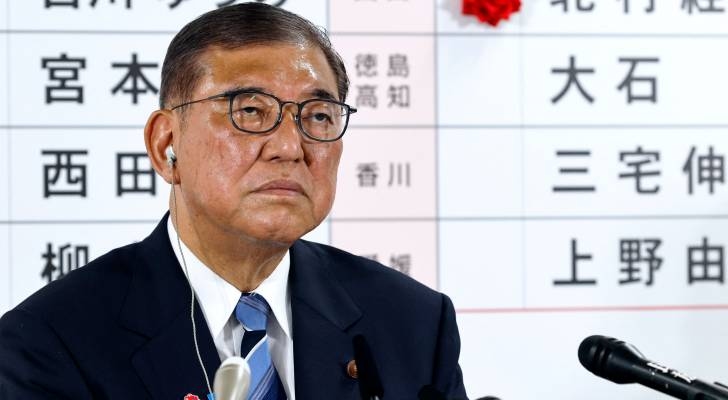 Japan PM hangs on after 'extremely regrettable' election