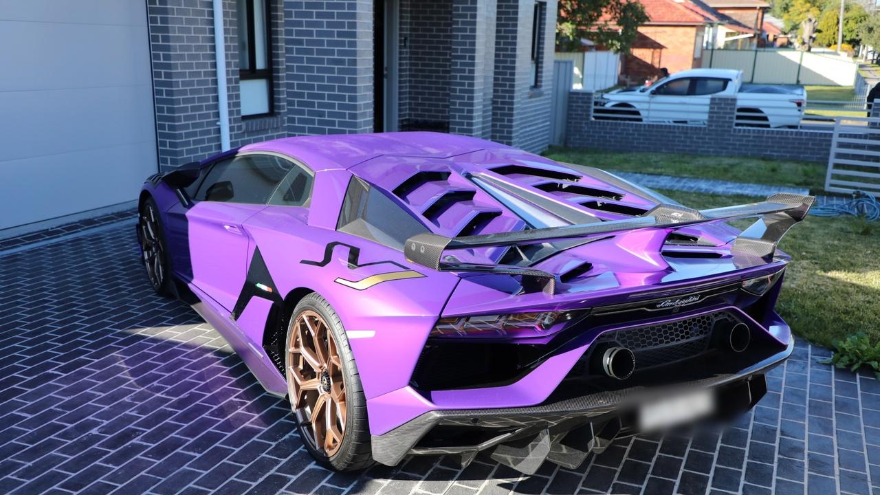 Sydney police bust fake luxury goods ring, seize cars, cash, firearms