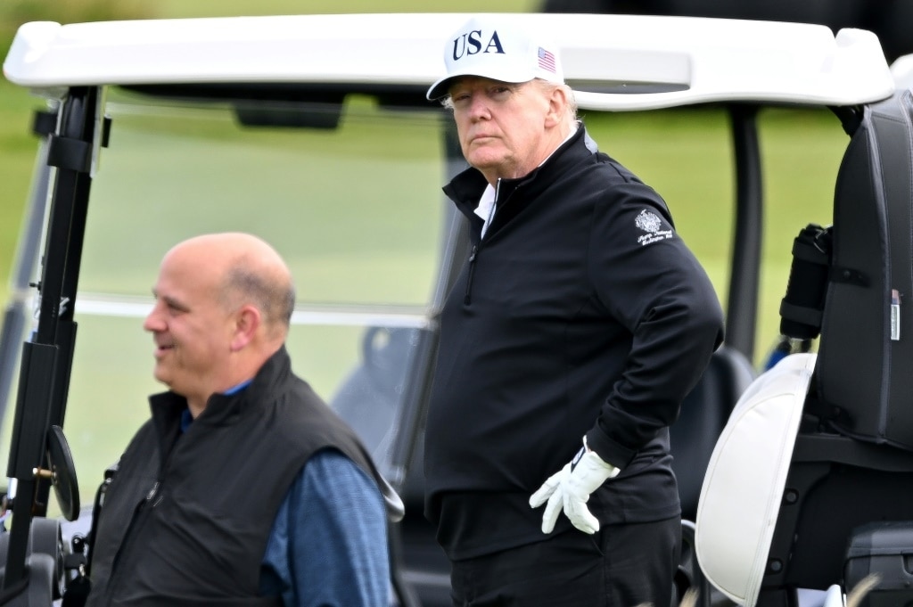 Trump plays golf in Scotland as protesters rally