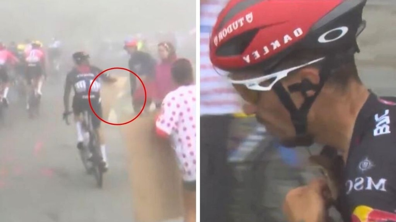 Bizarre moment Tour de France rider snatches cardboard sign off stunned fan