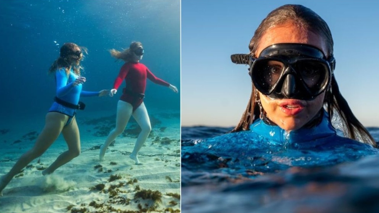 Women freediving for the escape at Gordons Bay, near Coogee