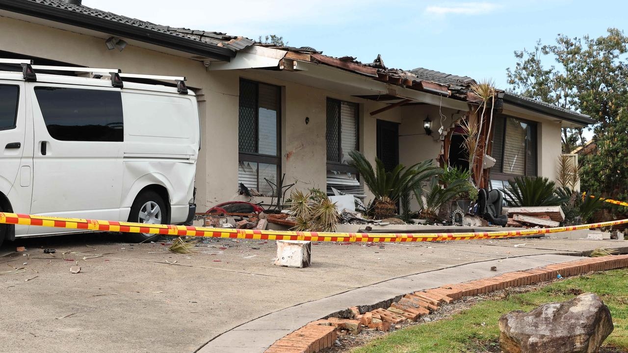 Driver flees after crashing car into house in St Andrews, Sydney