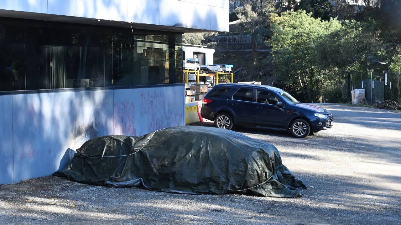 Victoria Police release CCTV footage of masked offenders who set cars on fire and graffitied business in Melbourne's north-east