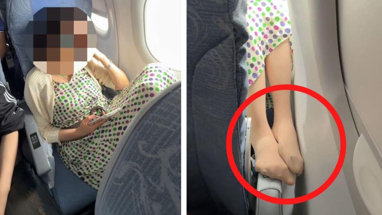 Plane passenger sticks her smelly feet through seat gap in front