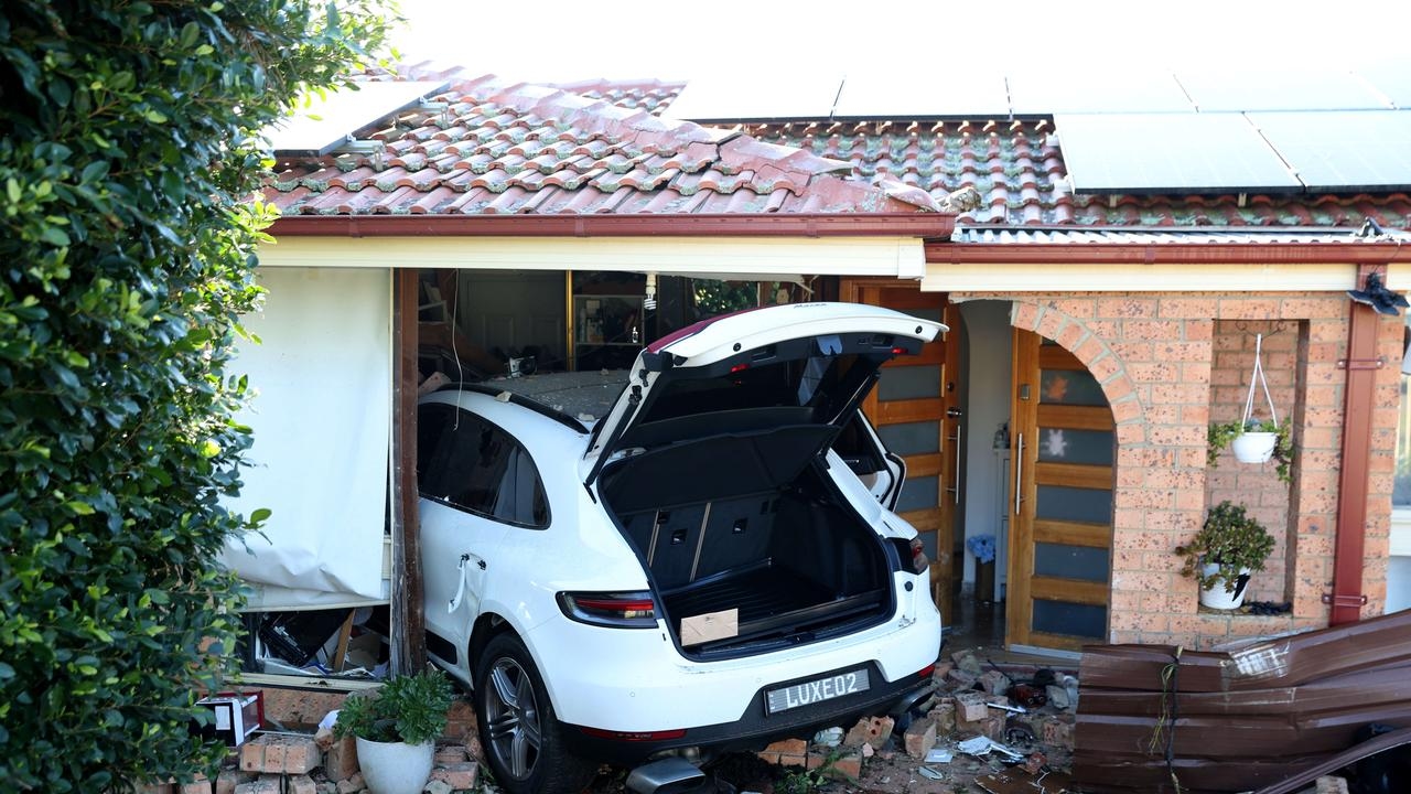 Macquarie Fields SUV crash lands on a bed, police hunt driver