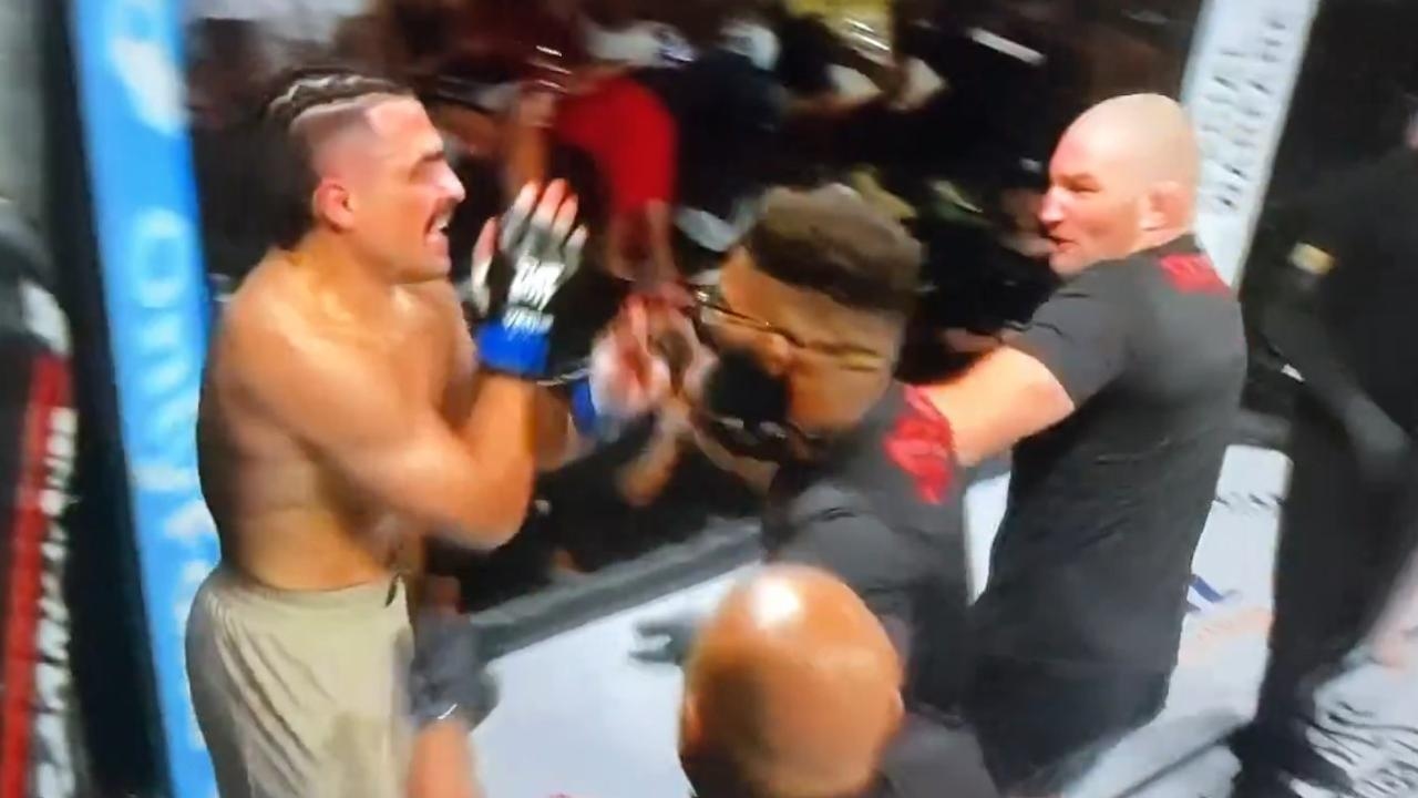 Former UFC champ Sean Strickland storms cage, punches fighter