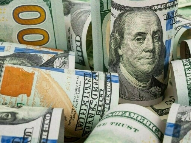 Dollar gains ground against major peers