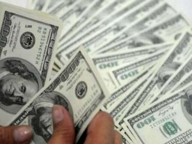 Dollar firms against peers