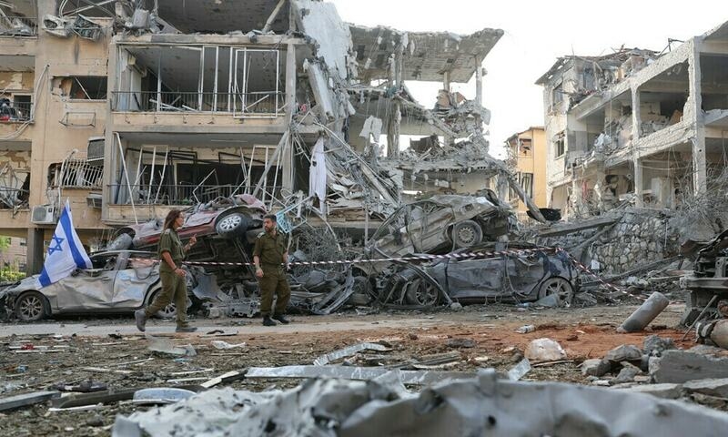 Israeli army official says Iran hit some military sites last month