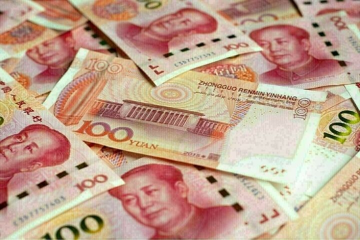 Yuan eases in tight trade