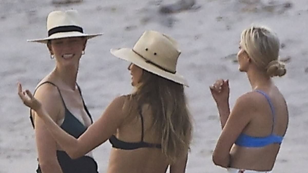 EXCLUSIVE Pregnant Karlie Kloss shows off her bump as she gossips with Gisele on beach for family double date