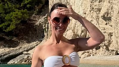 Chanelle Hayes sizzles in a white bikini as she soaks up the sun on a yacht in Tenerife after nine stone weight loss