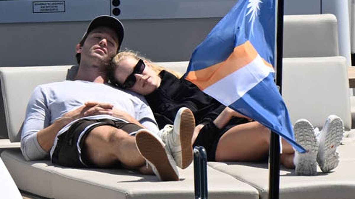 Patrick Schwarzenegger packs on PDA with stunning fiancée Abby Champion as loved-up couple cosy up together onboard boat in French Riviera