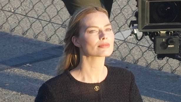 Margot Robbie shows off her toned postpartum figure in a red-hot swimsuit in Malibu