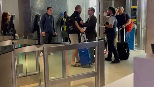 Wild scenes erupt at airport as passenger has a meltdown after he is blocked from boarding flight to Sydney