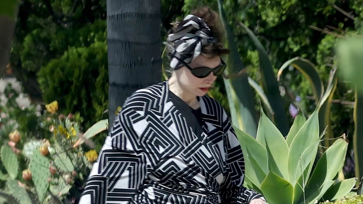 80s one-hit wonder looks unrecognizable on rare outing with duct-taped slippers... can you guess who it is?