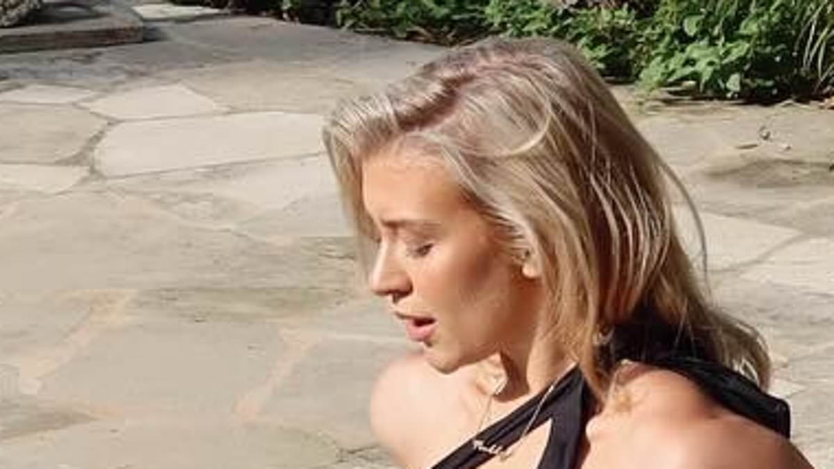 Love Island's Molly Marsh sets pulses racing in skimpy black swimwear as she sunbathes by the pool in Ibiza