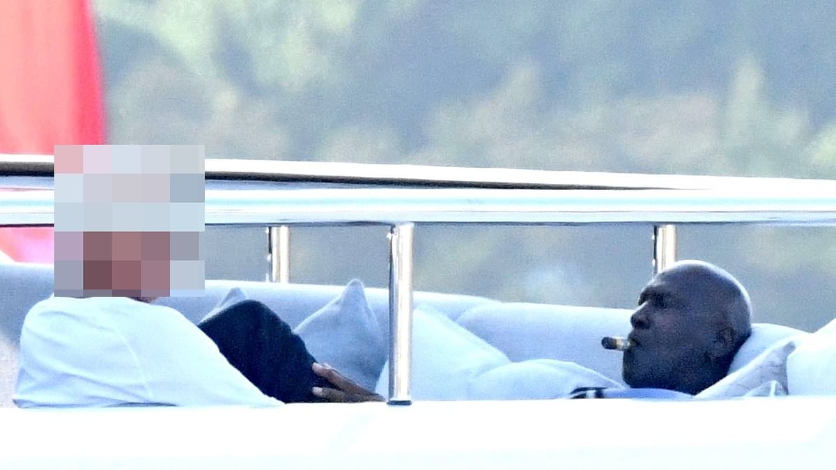 EXCLUSIVE Inside Michael Jordan's Italian getaway as he puffs a cigar on $115m superyacht... and a surprising confidant is revealed