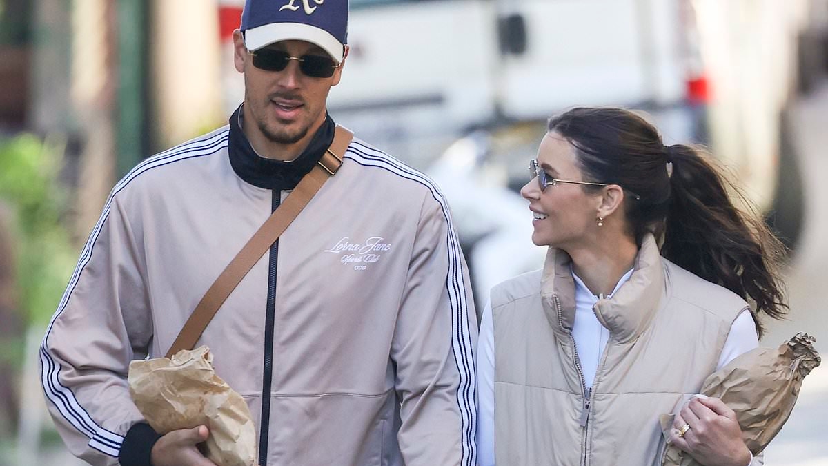 When one isn't enough! Brittany Hockley shows off her stack of wedding rings as she returns to Australia with new husband Benjamin Siegrist after Bali nuptials