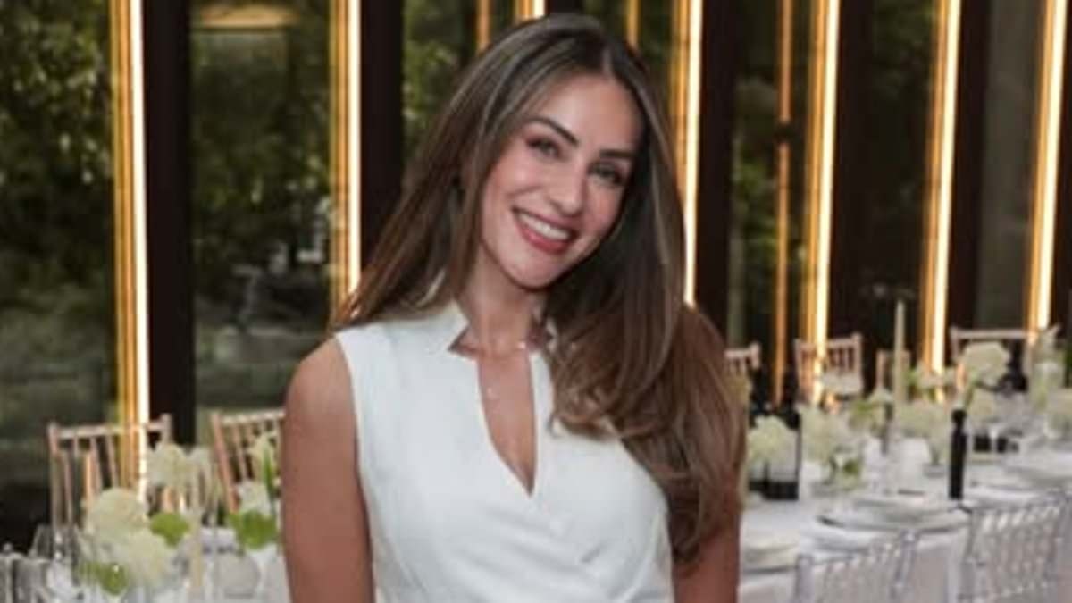 Influencer Lydia Millen stuns in a white summer maxi dress as she hosts exclusive dinner party to celebrate her latest collection with Karen Millen