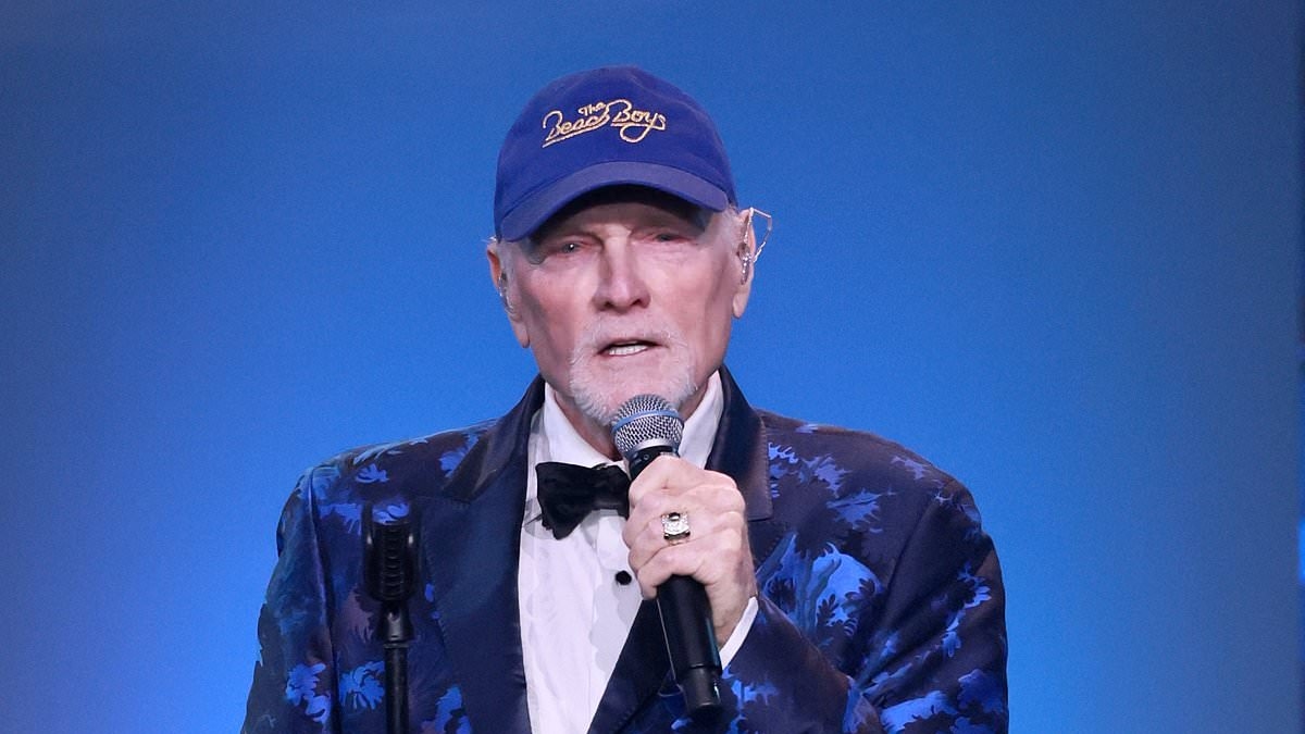 Beach Boys' Mike Love says he feels late bandmate Brian Wilson's 'presence' as he's inducted into the Songwriters Hall of Fame just one day after his friend's death