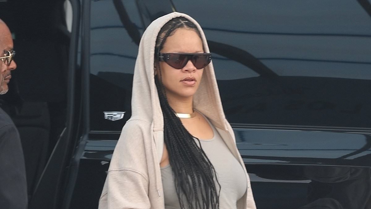 Rihanna dresses her baby bump in baggy sweats as pregnant star lands in Los Angeles