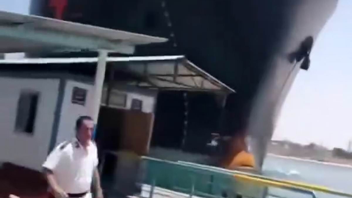 Terrifying moment out-of-control 700ft cargo ship crunches into Suez Canal port as workers run for their lives