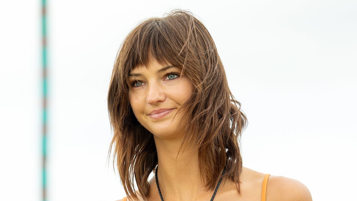 Romeo Beckham's ex-girlfriend Mia Regan displays her toned midriff in a sparkly bralette and cargo shorts at Worthy Farm during day two of Glastonbury