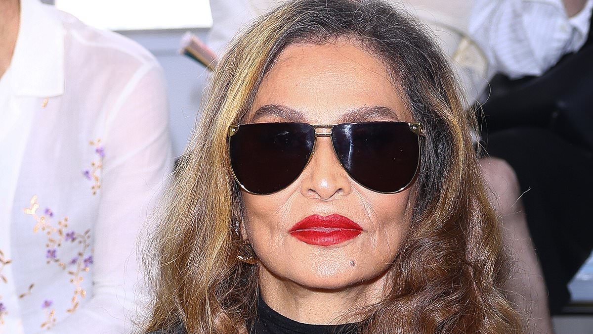 Tina Knowles, 71, and niece Angie Beyince, 42, match in dark sunglasses and red lipstick at the Bluemarble show during Paris Fashion Week