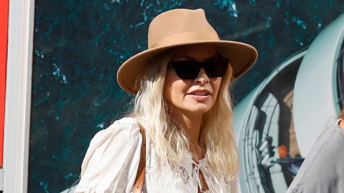 EXCLUSIVE Margot Robbie looks incredible in a black mini dress as she hosts a pool party at Glastonbury