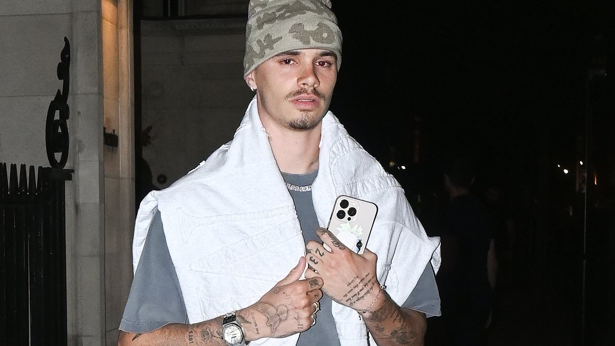 Romeo Beckham debuts new tattoo as he's spotted stepping out of £1,000-a-night Mayfair hotel after split from girlfriend Kim Turnbull