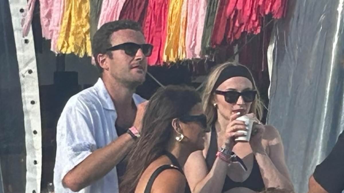 EXCLUSIVE Sophie Turner 'looks smitten' as she strolls hand-in-hand with aristocrat boyfriend Peregrine Pearson at Glastonbury after 'reconciling romance'