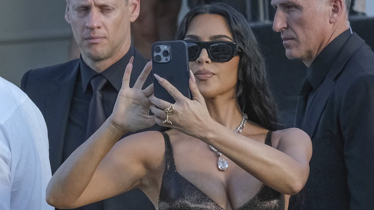 Kim Kardashian trolled for posting racy bikini snaps live from Bezos wedding in shameless self-promo stunt